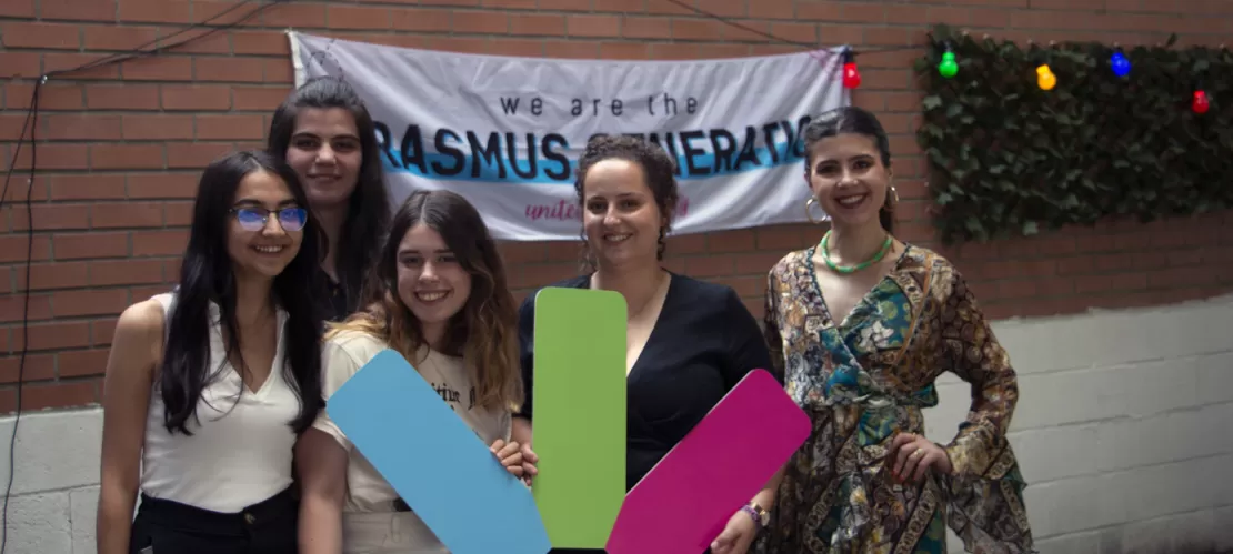 Five women posing for a picture with a big ESN star made out of cardboard.