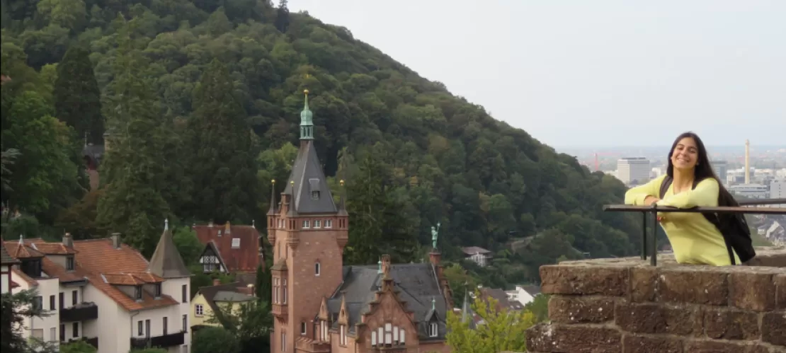 in a balcony in Heidelberg Castle, with beautiful houses and a mountain as background