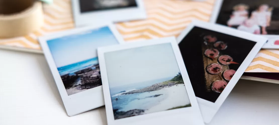 polaroid photos on table