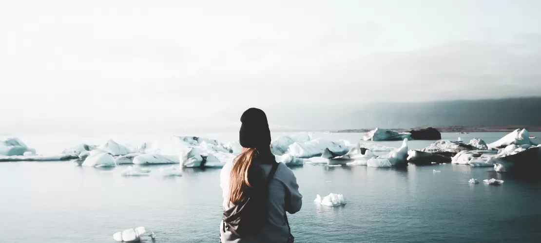 girl looking at some icebers