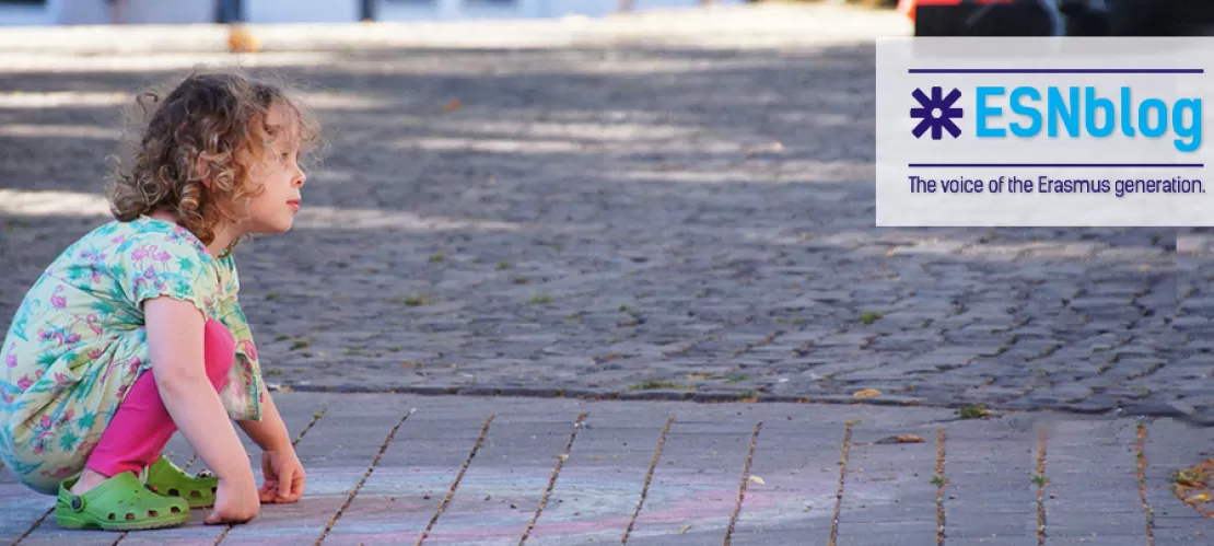 kid playing in the ground