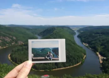 couple picture in front of same landscape