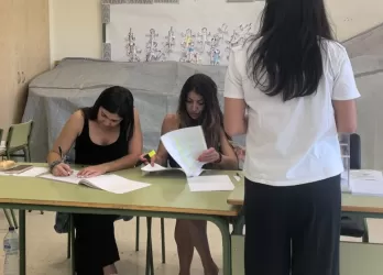 A young girl voting.