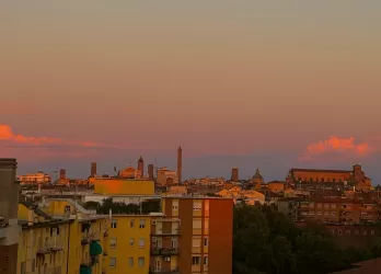 Picture of the sunset of a rooftop over Bologna, Italy