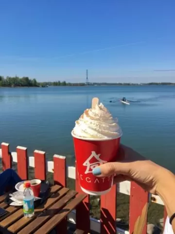 A photo of Sana showing sweet drink and the view