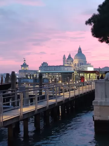 A building with a sunset in the back