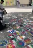 Drawn all the country flags on the concrete, main street in Frankfurt